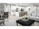 Open concept living room with kitchen and dining area featuring modern decor and hardwood floors at 1024 Country Pasture Cv, Wendell, NC 27591