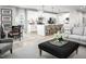 Open concept living room with kitchen and dining area featuring modern decor and hardwood floors at 1024 Country Pasture Cv, Wendell, NC 27591