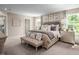 Large main bedroom with plush bedding and a neutral color scheme at 1024 Country Pasture Cv, Wendell, NC 27591