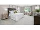 Comfortable main bedroom featuring ample natural light, seating area, and stylish furnishings at 1024 Country Pasture Cv, Wendell, NC 27591
