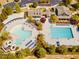 Aerial view of community pool, clubhouse, and surrounding landscape at 106 Park Manor Ln, Cary, NC 27519