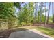Private backyard with patio and lush landscaping at 106 Park Manor Ln, Cary, NC 27519