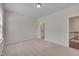 Spacious bedroom with carpeting and access to a bathroom at 106 Park Manor Ln, Cary, NC 27519