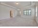 Primary bedroom with access to private bathroom and balcony at 106 Park Manor Ln, Cary, NC 27519