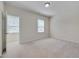 Bright bedroom with neutral carpeting and two windows at 106 Park Manor Ln, Cary, NC 27519