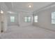 Spacious bedroom with large windows and plush carpeting at 106 Park Manor Ln, Cary, NC 27519