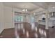 Spacious dining room with hardwood floors and a view into the kitchen at 106 Park Manor Ln, Cary, NC 27519