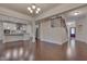 Open concept dining room with hardwood floors and kitchen access at 106 Park Manor Ln, Cary, NC 27519