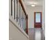 Hardwood floor entryway, featuring a staircase and an elegant door at 106 Park Manor Ln, Cary, NC 27519