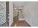 Bright entryway with hardwood floors, staircase, and elegant door at 106 Park Manor Ln, Cary, NC 27519