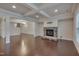 Gathering room with stone fireplace and hardwood floors at 106 Park Manor Ln, Cary, NC 27519