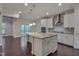 Modern kitchen with granite countertops, stainless steel appliances, and hardwood floors at 106 Park Manor Ln, Cary, NC 27519