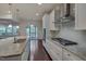 Modern kitchen with granite countertops, stainless steel appliances, and white cabinetry at 106 Park Manor Ln, Cary, NC 27519