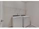 Laundry room with washer, dryer, and overhead shelving at 106 Park Manor Ln, Cary, NC 27519