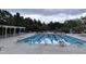 Community pool with lanes, lounge chairs, and a waterslide at 106 Park Manor Ln, Cary, NC 27519