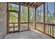 Screened porch with wooden frame and access to backyard at 106 Park Manor Ln, Cary, NC 27519