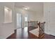 Upstairs hallway with hardwood floors and railing at 106 Park Manor Ln, Cary, NC 27519