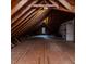 Spacious attic with exposed wooden beams, offering potential for storage or customization at 120 Crosby Ln, Sanford, NC 27330