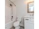 Bathroom featuring a white vanity with a marble countertop, a wooden-framed mirror and bathtub at 120 Crosby Ln, Sanford, NC 27330