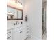 Beautiful bathroom boasts a wood-framed mirror, stylish sink, and modern vanity at 120 Crosby Ln, Sanford, NC 27330