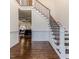 Elegant foyer with hardwood floors, wainscoting, and staircase with iron railings at 120 Crosby Ln, Sanford, NC 27330
