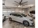 Spacious garage with a car, motorcycle, and multiple garage doors for easy access at 120 Crosby Ln, Sanford, NC 27330