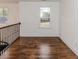 Hallway featuring hardwood floors, staircase, and window for plenty of light at 120 Crosby Ln, Sanford, NC 27330