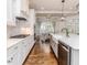 Well-appointed kitchen with white cabinetry, stainless appliances, and dining area at 120 Crosby Ln, Sanford, NC 27330