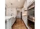 Spacious kitchen features stainless steel appliances, a large island, and beautiful hardwood floors at 120 Crosby Ln, Sanford, NC 27330