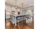 The spacious kitchen features a large island and modern lighting fixtures at 120 Crosby Ln, Sanford, NC 27330