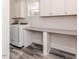 Bright laundry room with a utility sink, counter space, and washer/dryer at 120 Crosby Ln, Sanford, NC 27330