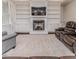 This living room showcases a fireplace, built-in shelving, and plush carpeting at 120 Crosby Ln, Sanford, NC 27330
