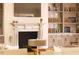 Living room featuring a fireplace and built-in shelving at 1521 Canterbury Rd, Raleigh, NC 27608