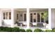 Covered porch with comfortable seating and lush greenery at 1521 Canterbury Rd, Raleigh, NC 27608