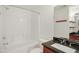 Clean bathroom with tub, granite vanity, and modern fixtures at 1673 Snowmass Way, Durham, NC 27713
