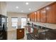 Kitchen with island, stainless steel appliances, and granite countertops at 1673 Snowmass Way, Durham, NC 27713