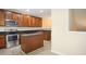 Kitchen with island, stainless steel appliances, and granite countertops at 1673 Snowmass Way, Durham, NC 27713