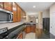 Kitchen boasts stainless steel appliances and granite countertops at 1673 Snowmass Way, Durham, NC 27713
