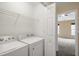 Laundry room with washer, dryer, and additional storage at 1673 Snowmass Way, Durham, NC 27713
