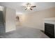 Living room with fireplace, stairs, and kitchen view at 1673 Snowmass Way, Durham, NC 27713
