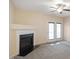 Living room features a fireplace and access to a deck at 1673 Snowmass Way, Durham, NC 27713