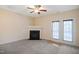 Living room with fireplace and double doors leading outside at 1673 Snowmass Way, Durham, NC 27713