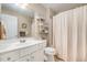 Clean bathroom with white vanity, toilet and shower curtain at 2112 White Pond Ct, Apex, NC 27523