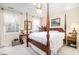 Bedroom with a large four-poster bed and ample space at 2112 White Pond Ct, Apex, NC 27523