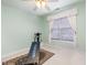 Small bedroom with window, wall-mounted exercise equipment at 2112 White Pond Ct, Apex, NC 27523