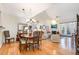 Formal dining room with hardwood floors and a charming chandelier at 2112 White Pond Ct, Apex, NC 27523