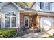 Brick front porch with seating area, creating a welcoming entryway at 2112 White Pond Ct, Apex, NC 27523