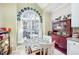 Bright kitchen nook with decorative plates and a charming table with seating for four at 2112 White Pond Ct, Apex, NC 27523