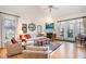 Bright living room with vaulted ceilings, a fireplace, hardwood floors, and ample seating at 2112 White Pond Ct, Apex, NC 27523