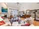 Open living room with hardwood floors, fireplace, and access to backyard at 2112 White Pond Ct, Apex, NC 27523